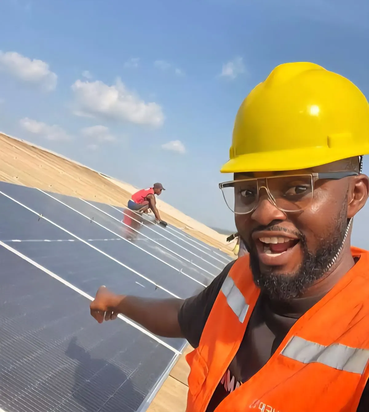 Solar installation technician on rooftop, Unity Schools